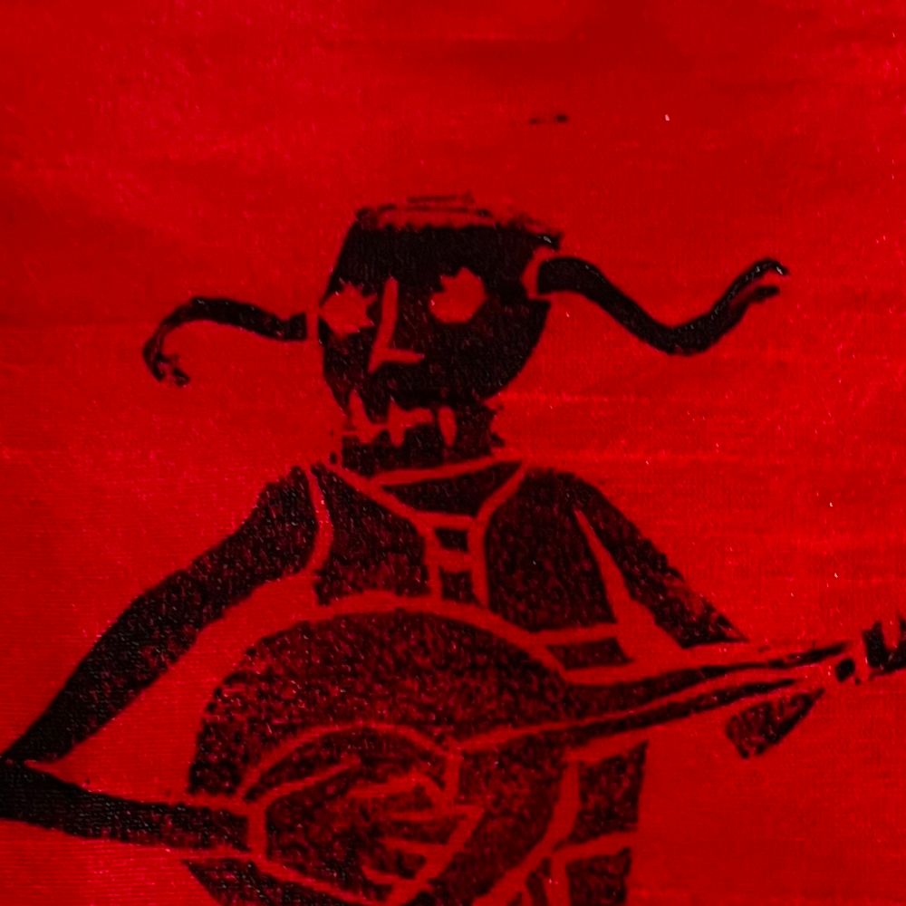 Artists Painting of a silhouetted horned skeleton playing a guitar against a red background